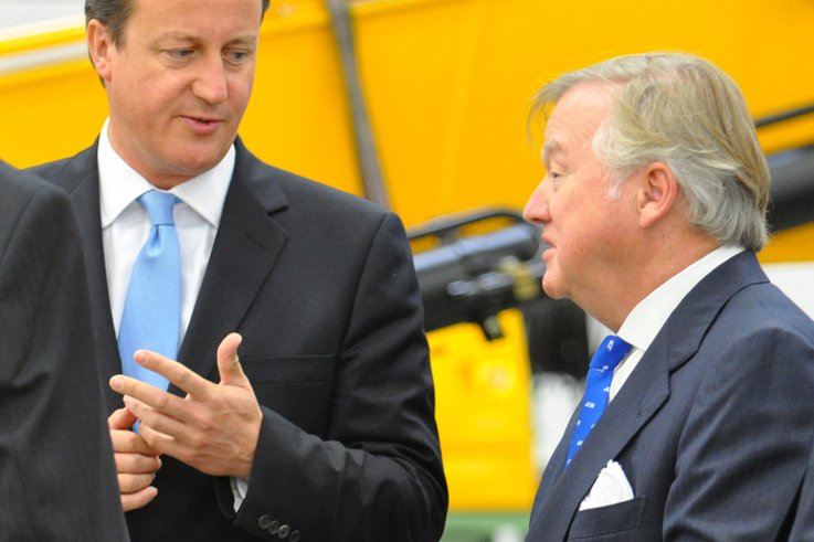 Prime Minister David Cameron and JCB Chairman Sir Anthony Bamford on the Heavy Excavator production line at JCB Brazil