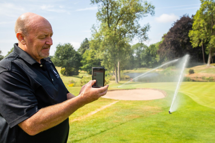 Breadsall Priory - Course manager John Smith operating Toro's Lynx central control system from his phone..jpg