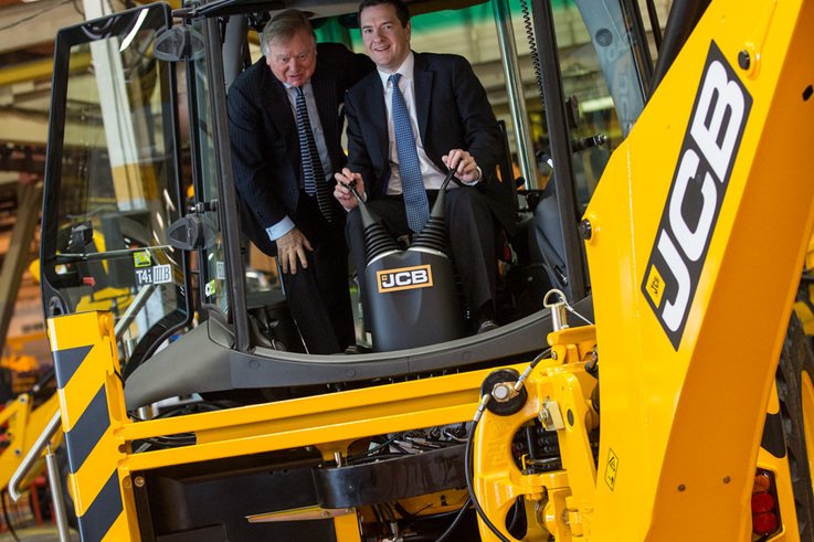 Lord Bamford (left) with the Chancellor in the cab of a JCB backhoe loader