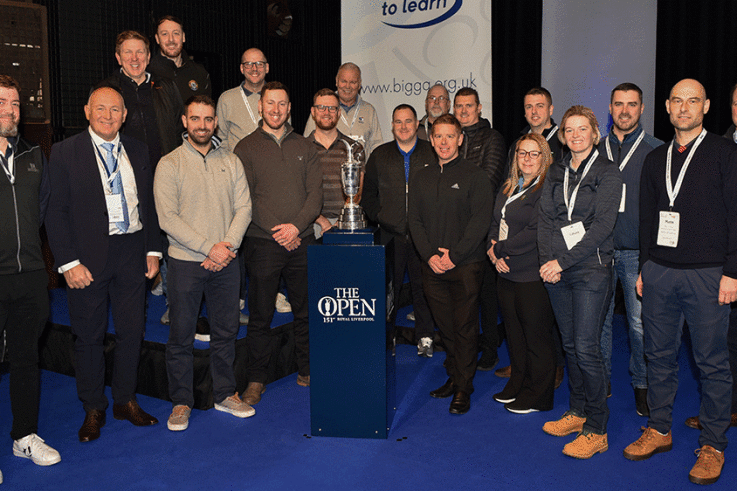 Previous-members-of-The-Open-Volunteer-Support-Team-joinerd-the-Claret-Jug-on-stage-at-BTME-in-January.gif