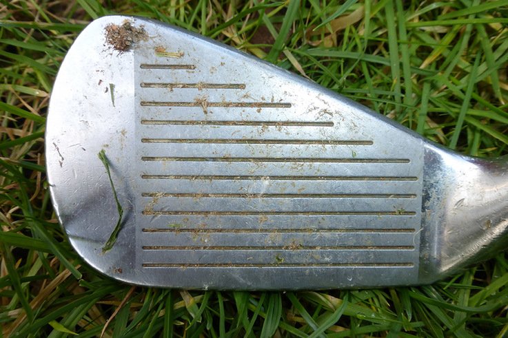 Plate 2 Golf club with soil and sand in grooves