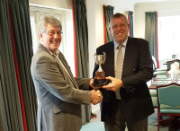 Highspeed's MD David Mears presents the CourseCare Cup to Kevin Pickett GCMA Wessex Captain