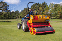 Vredo seeder in action on a green