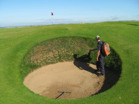 IMG_7040  Blowing out sand from bunker face  Royal Porthcawl.JPG