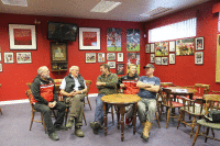 Turf team discussion in the bar