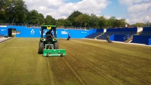 Figure 1- Our Garden, tearing in to the Centre Court surface to remove any thatch buildup.