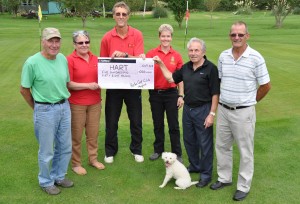 HENFIELD HART cheque from Horton Golf Club. L R Brian Woolven, Anne Pryor, Martin Tooth, Kas Fletcher (with Sasha the HART mascot), Albert Stillwell and Brian Cullen. Pic by Mike Beardall, Oakfield Media DSC 0942